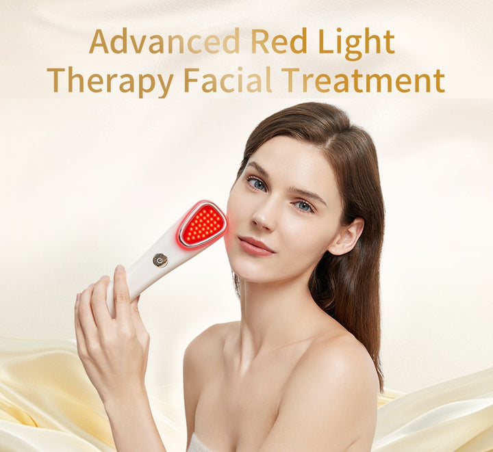 Woman holding LED wand with warm compress on cheek with a beige background